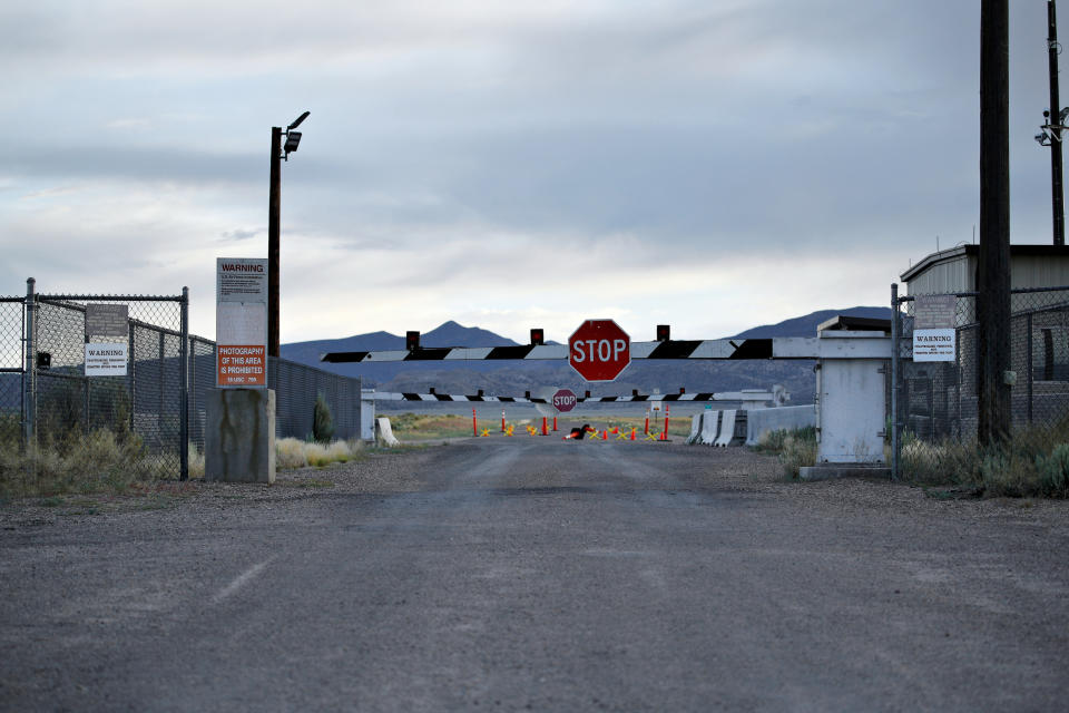 FILE - In this July 22, 2019 file photo, signs warn about trespassing at an entrance to the Nevada Test and Training Range near Area 51 outside of Rachel, Nev. A second rural Nevada county prepared Thursday, Aug. 29, for a "Storm Area 51" event that began as an internet joke but has drawn millions of social media fans. Organizers of the event hope people will gather and try to make their way into the once top-secret U.S. Air Force test area known in popular lore as a site for government studies of outer space aliens. (AP Photo/John Locher, File)