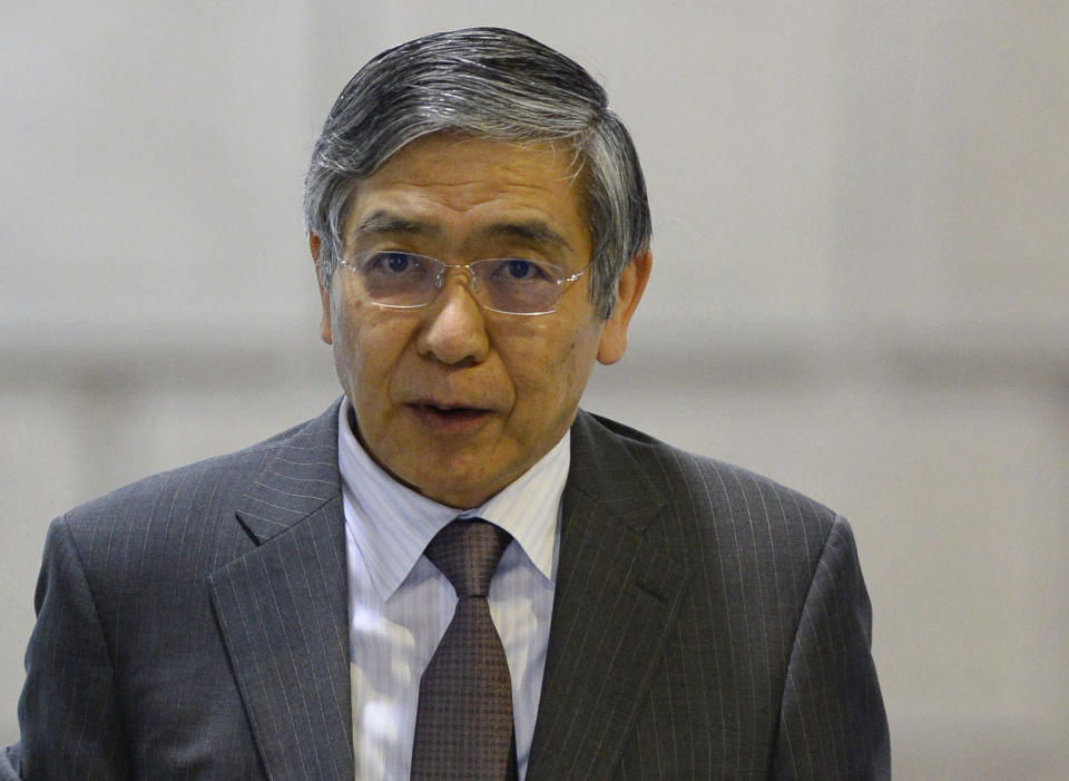 Bank of Japan Gov. Haruhiko Kuroda heads to a meeting at the headquarters of Bank of Japan in Tokyo, Wednesday, April 30, 2014. Japan's central bank was meeting Wednesday to assess the status of the country's economic recovery, as monthly data showed industrial output and wage growth falling short of expectations. (AP Photo/Kyodo News) JAPAN OUT, MANDATORY CREDIT