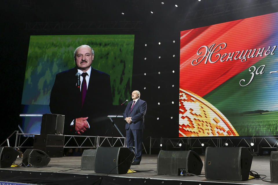 Belarusian President Alexander Lukashenko addresses a women's forum in Minsk, Belarus, Thursday, Sept. 17, 2020. Lukashenko has given a speech at a women's forum with some good quotes—he's announced Belarus will close the border with Ukraine, Poland and Lithuania, and is mobilizing half the army. (BelTA Pool Photo via AP)