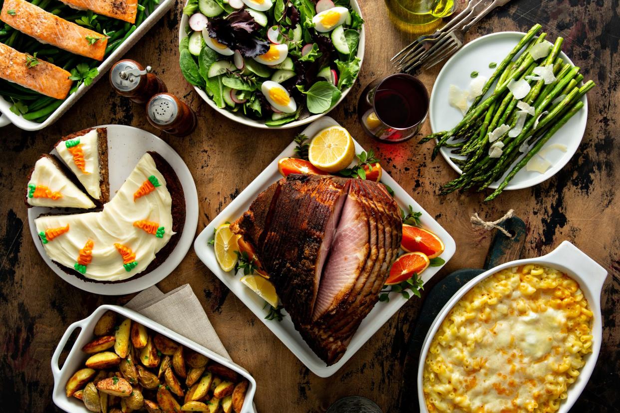 Easter dinner table with ham, asparagus and carrot cake