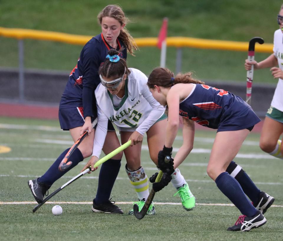 Lakeland's Isabella Basulto is pressured by Horace Greeley's Alyssa Rose, left, and Dani Halperin during their game at Lakeland Oct. 3, 2022. Lakeland won 1-0.