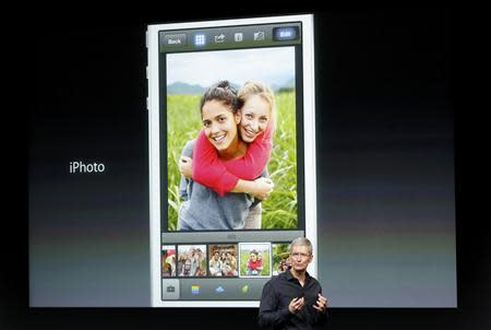 Apple Inc CEO Tim Cook talks during Apple Inc's media event in Cupertino, California September 10, 2013. REUTERS/Stephen Lam