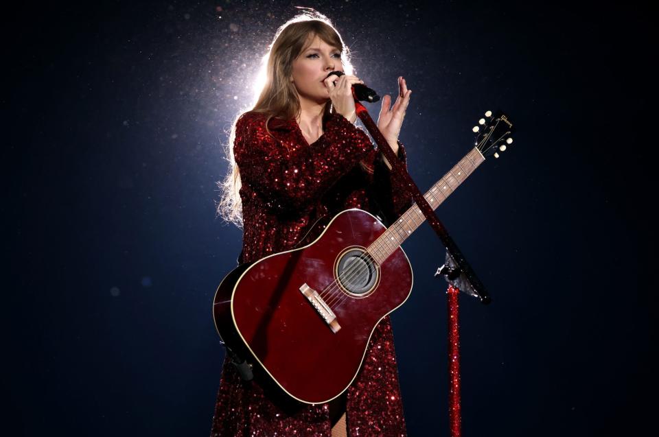 <p>Swift threw on an Ashish coat over her romper as she performed <a href="https://people.com/music/taylor-swift-releases-10-minute-all-too-well-version-review-lyrical-breakdown/" rel="nofollow noopener" target="_blank" data-ylk="slk:her 10-minute version of "All Too Well";elm:context_link;itc:0;sec:content-canvas" class="link ">her 10-minute version of "All Too Well"</a> on stage with a coordinating red guitar.</p>