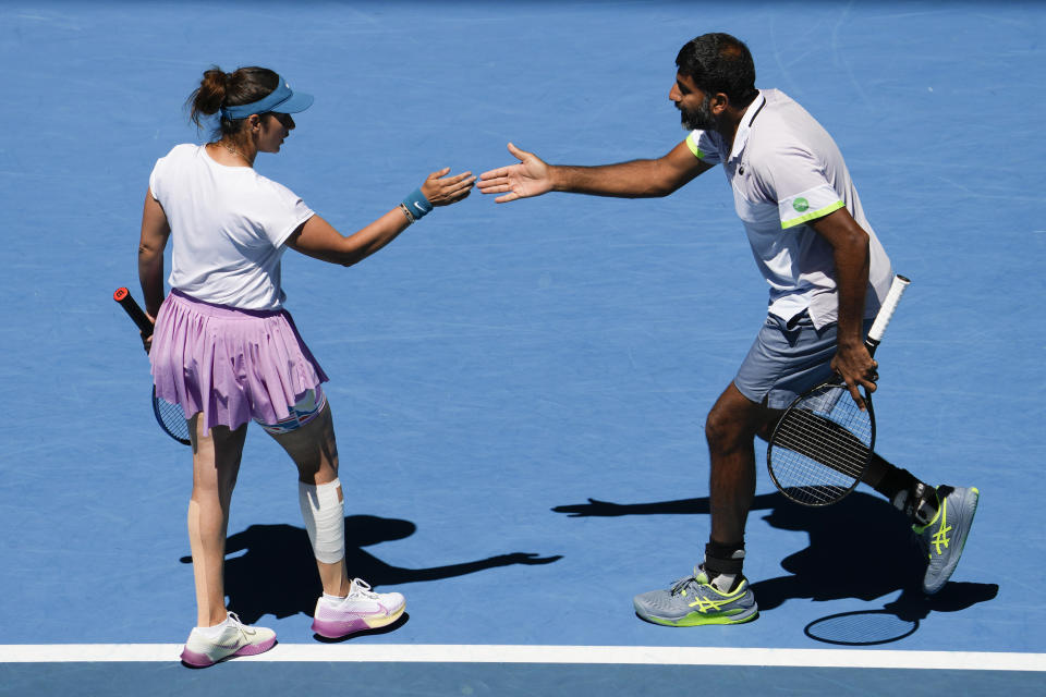 India's Rohan Bopanna and Sania Mirza react during the mixed doubles final against Brazil's Luisa Stefani and Rafael Matos at the Australian Open tennis championship in Melbourne, Australia, Friday, Jan. 27, 2023. (AP Photo/Ng Han Guan)