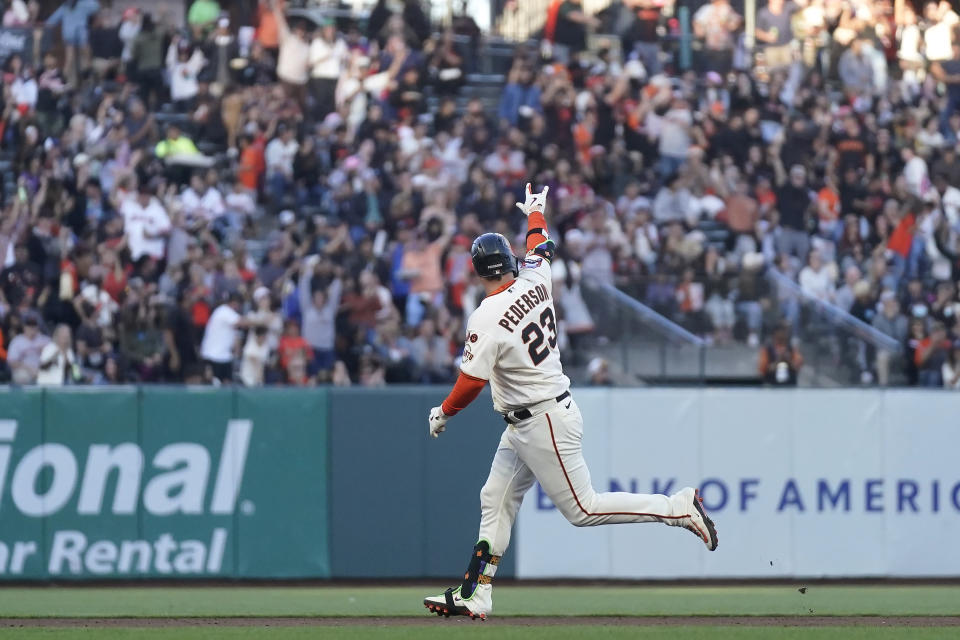 San Francisco Giants' Joc Pederson gestures toward fans after hitting a home run against the Colorado Rockies during the fifth inning of a baseball game in San Francisco, Sunday, Sept. 10, 2023. (AP Photo/Jeff Chiu)