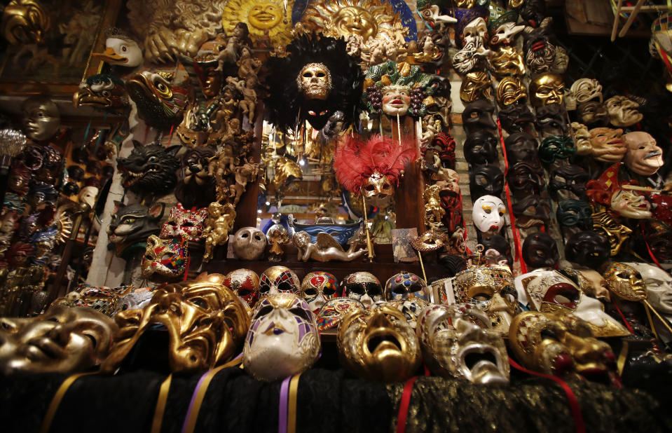 Carnival masks are laid out on display in Venetian artisan mask maker Gualtiero Dall'Osto's workshop in Venice, Italy, Saturday, Jan. 30, 2021. (AP Photo/Antonio Calanni)