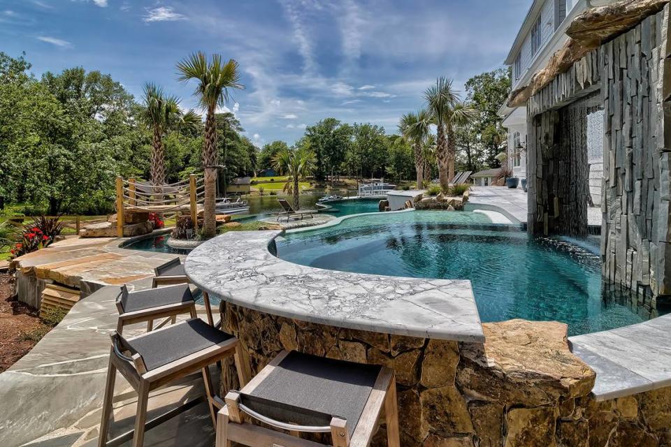 An image of a swim-up bar at a $3.4 million luxury home for sale on Lake Murray.