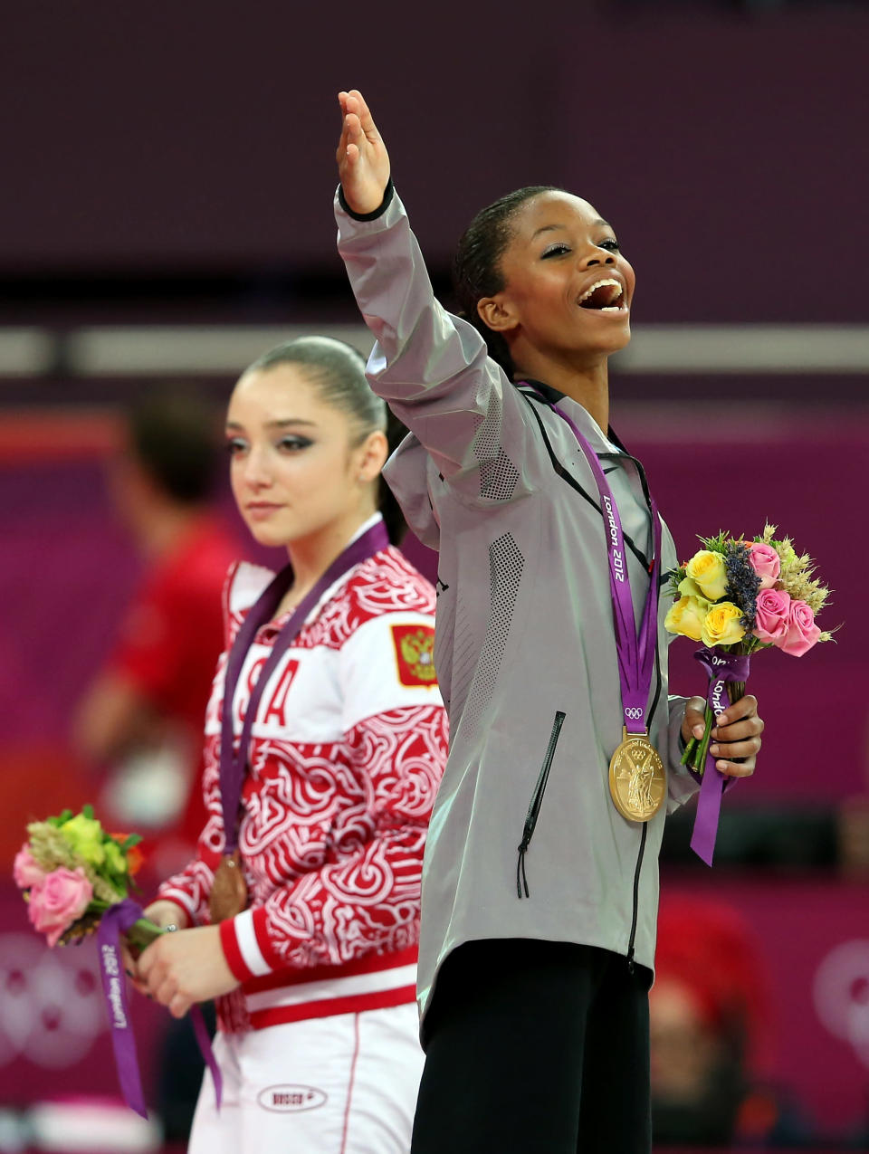 Gabrielle Douglas of the United States celebrates on the podium after winning the gold medal in the Artistic Gymnastics Women's Individual All-Around final on Day 6 of the London 2012 Olympic Games at North Greenwich Arena on August 2, 2012 in London, England. (Photo by Julian Finney/Getty Images)