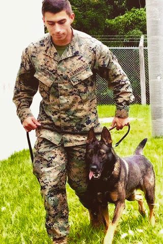 <p>American Humane</p> Sgt. Isaac Weissend with his canine partner Poker while serving overseas in Japan