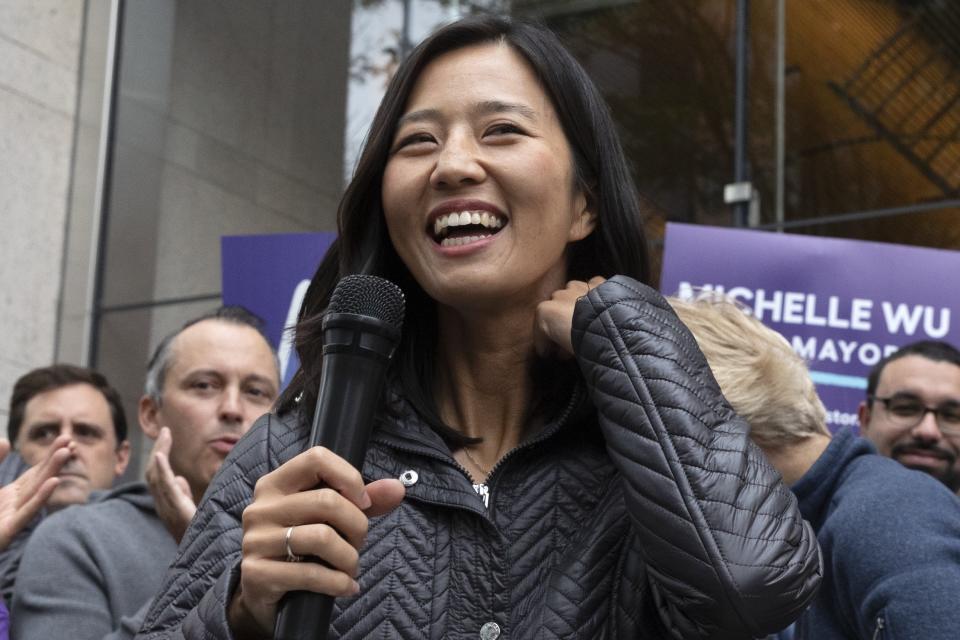 FILE — Boston mayoral candidate Michelle Wu campaigns in this Saturday, Oct. 23, 2021, in Boston. On Tuesday, Wu, a daughter of Taiwanese immigrants, faces off against Annissa Essaibi George. Whoever wins will be the first woman and first person of color elected to the city's top political office. (AP Photo/Michael Dwyer, File)