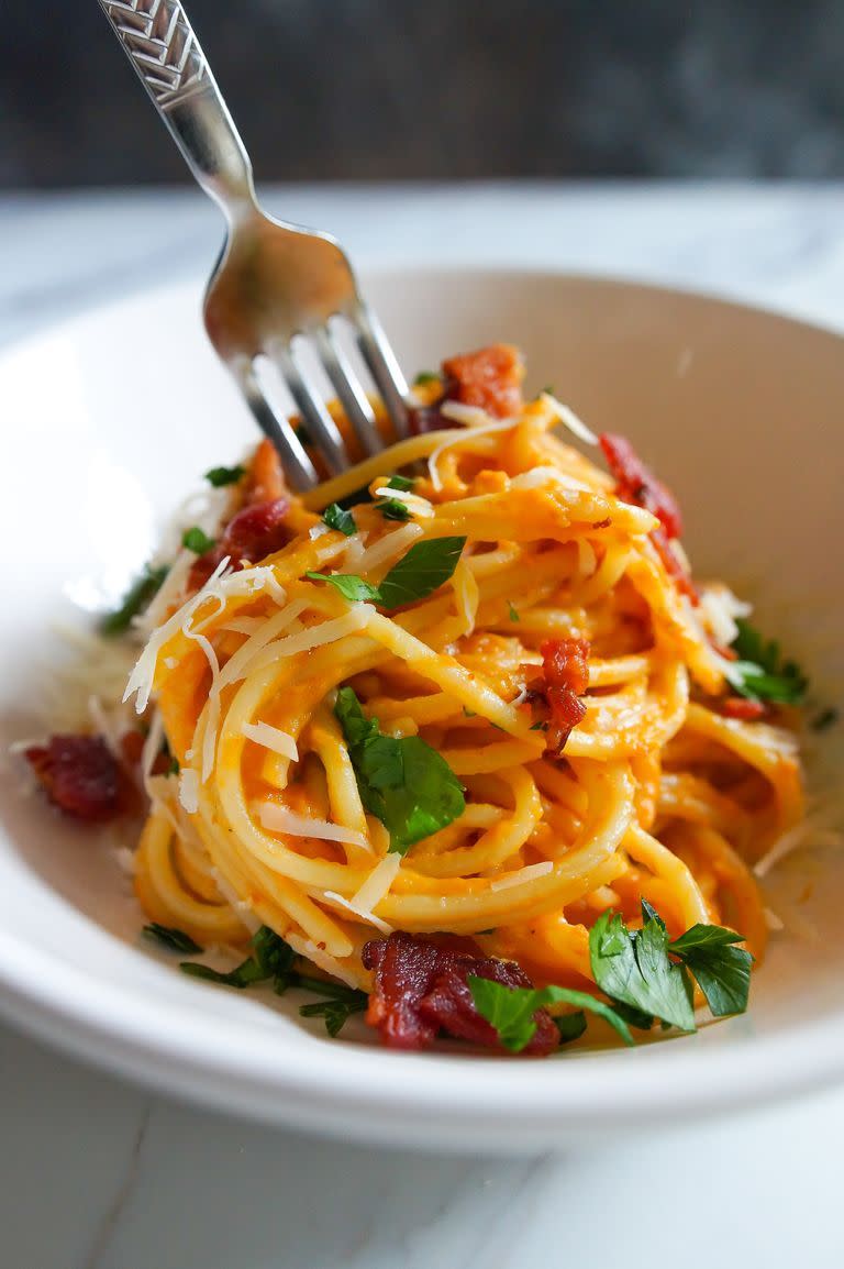 <p>Pumpkin purée stirred into the sauce gives a fall twist to this classic dish of eggs, bacon, cheese and pasta.</p><p><em><a href="https://www.thepioneerwoman.com/food-cooking/recipes/a100306/pumpkin-bacon-carbonara/" rel="nofollow noopener" target="_blank" data-ylk="slk:Get the recipe from The Pioneer Woman »;elm:context_link;itc:0;sec:content-canvas" class="link ">Get the recipe from The Pioneer Woman »</a></em></p>