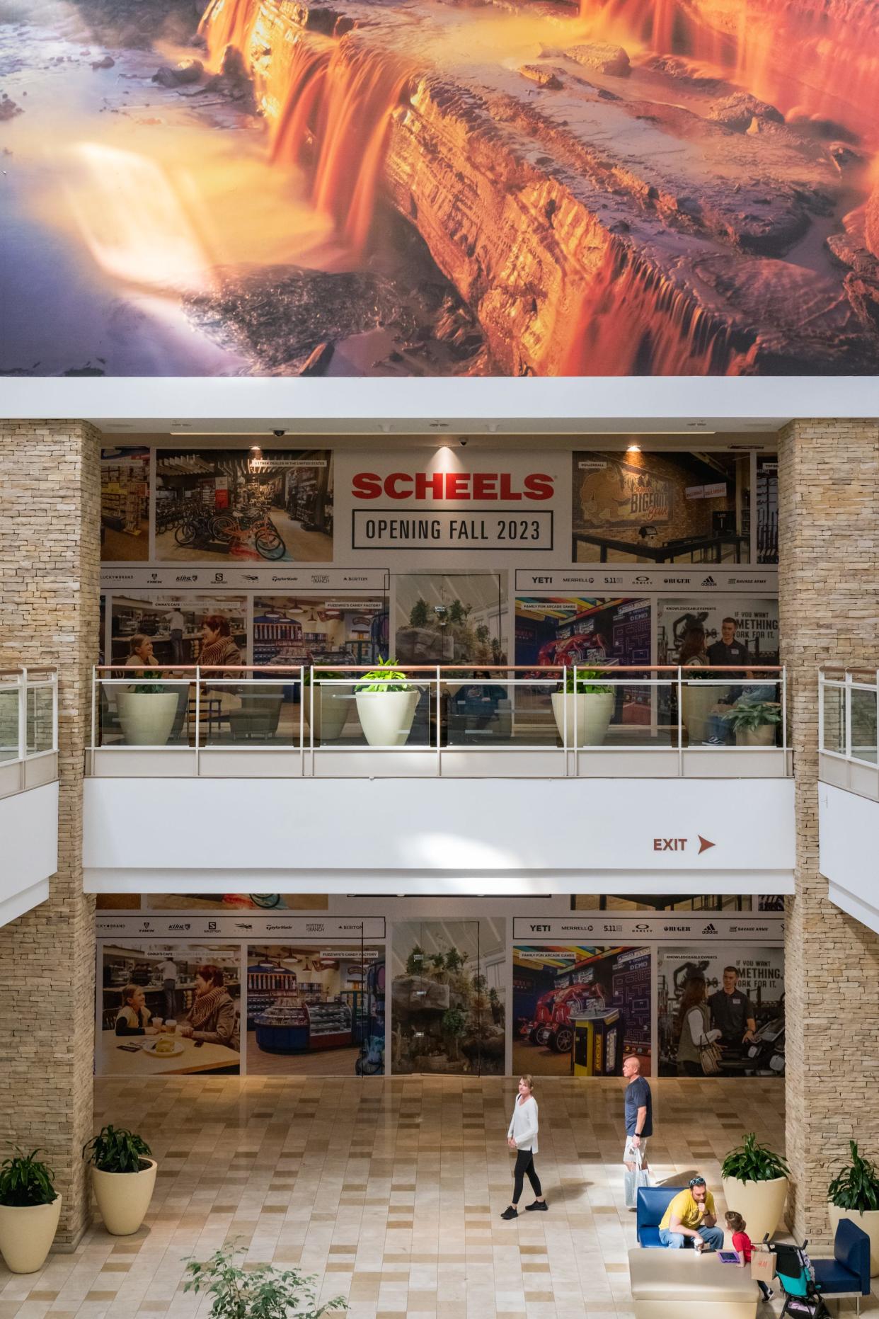 Signs hang where Arizona's first Scheels sporting goods store will open in the fall of 2023 in the Chandler Fashion Center.