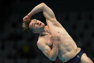 Jack Laugher of Britain competes in men's diving 3m springboard final at the Tokyo Aquatics Centre at the 2020 Summer Olympics, Tuesday, Aug. 3, 2021, in Tokyo, Japan. (AP Photo/Dmitri Lovetsky)