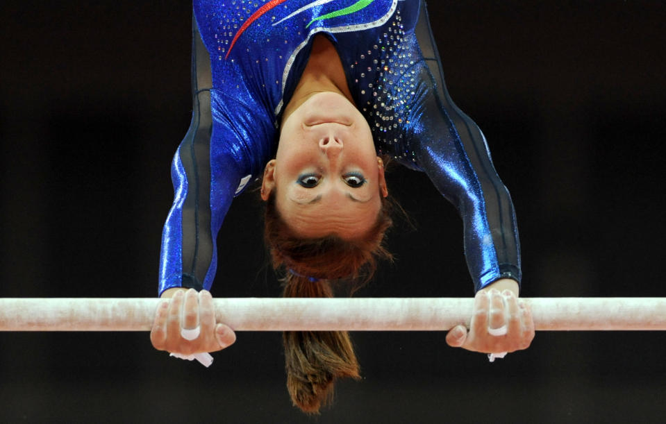 Italy's Vanessa Ferrari competes on the uneven bars during the Artistic Gymnastics team qualification at the North Greenwich Arena, London on the second day of the London 2012 Olympics.. 