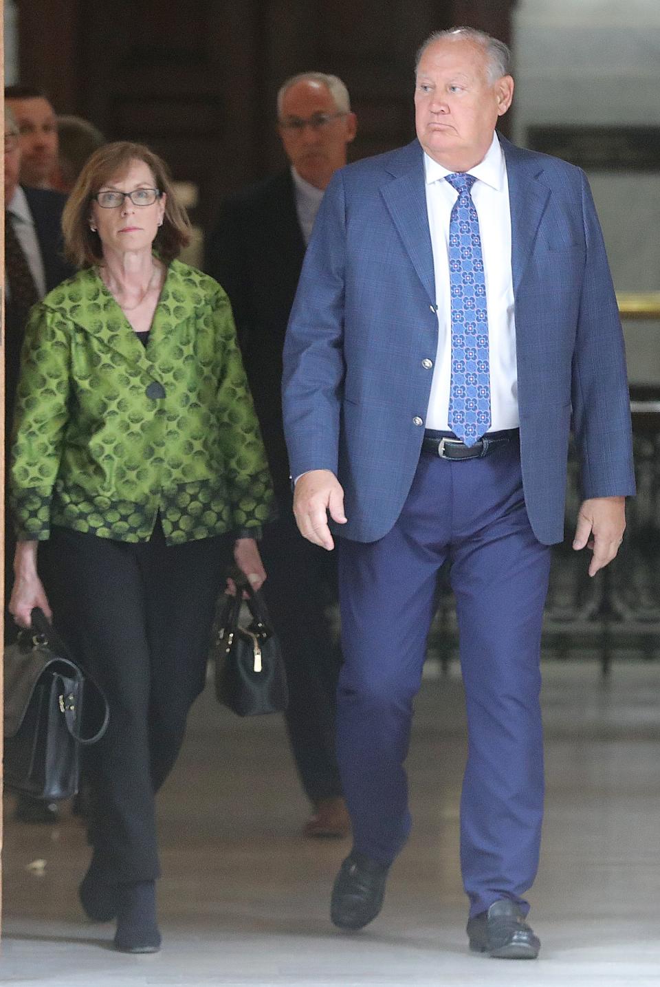 Former FirstEnergy CEO Charles "Chuck" Jones arrives in Summit County Court with his attorney Carole Rendon to be arraigned before Judge Susan Baker Ross on charges related to the FirstEnergy scandal on Tuesday, Feb. 13, 2024, in Akron, Ohio. [Phil Masturzo/ Beacon Journal]