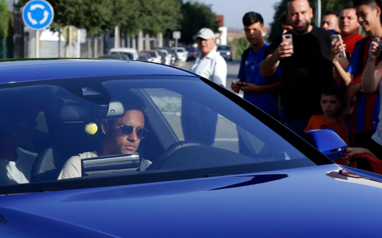 Neymar arriving at Barcelona's training ground this morning - AP