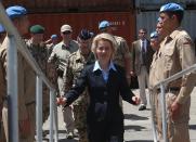 German Defense Minister Ursula von der Leyen, center, boards a German UNIFIL vessel, at the seaport of Beirut, Lebanon, Thursday April 24, 2014. Minister Ursula von der Leyen is in Lebanon to meet with the Lebanese officials and to visit her country’s naval troops. Germany has been a contributor since 2006 to the UNIFIL maritime mission in Lebanon which aims at supporting the Lebanese navy in securing Lebanon’s maritime borders. (AP Photo/Hussein Malla)