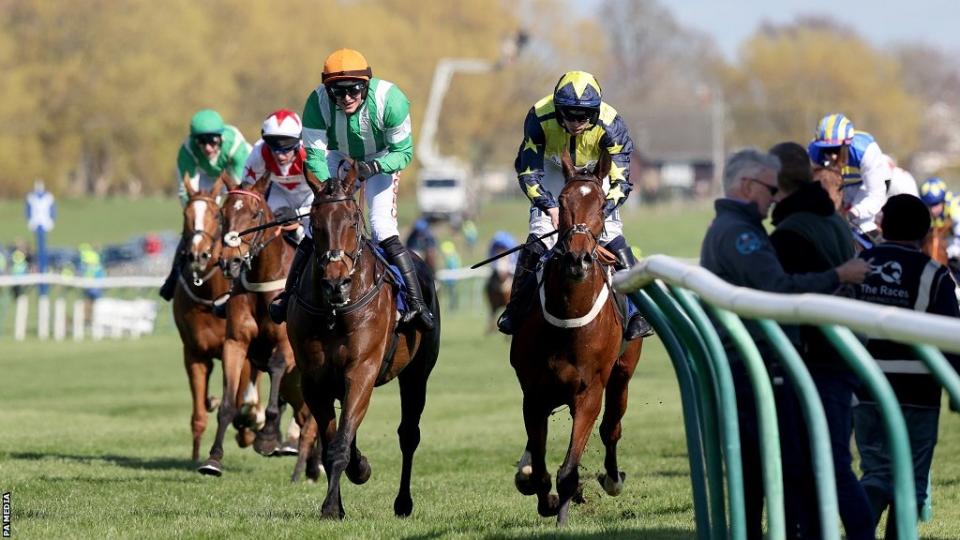 Macdermott leads Surrey Quest in the closing stages of the Scottish Grand National