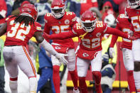 Kansas City Chiefs safety Juan Thornhill (22) is congratulated by teammate Nick Bolton (32) after intercepting a pass during the second half of an NFL football game against the Seattle Seahawks Saturday, Dec. 24, 2022, in Kansas City, Mo. (AP Photo/Ed Zurga)