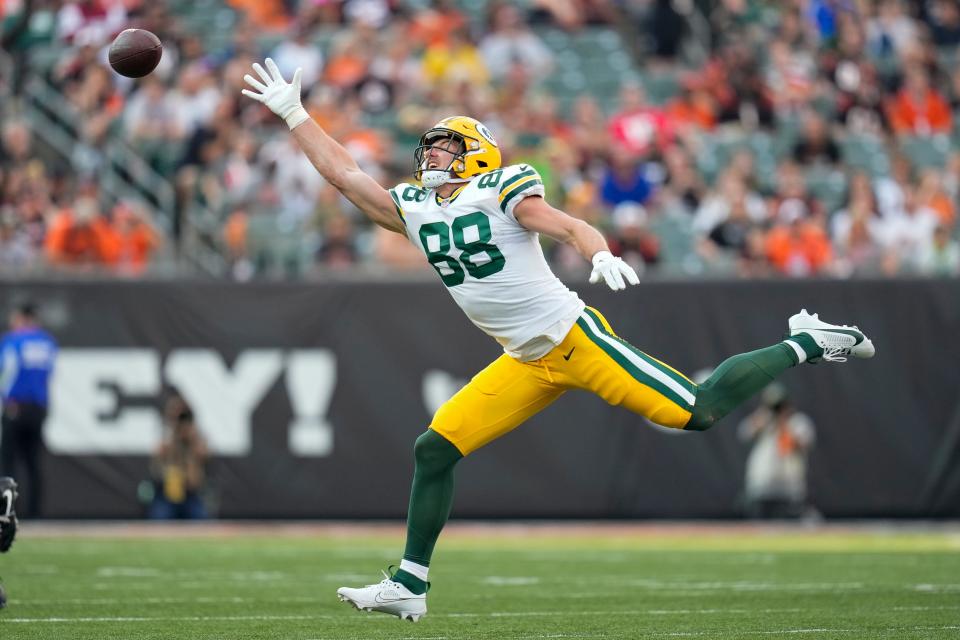 Green Bay Packers tight end <a class="link " href="https://sports.yahoo.com/nfl/players/40074" data-i13n="sec:content-canvas;subsec:anchor_text;elm:context_link" data-ylk="slk:Luke Musgrave;sec:content-canvas;subsec:anchor_text;elm:context_link;itc:0">Luke Musgrave</a> (88) stretches for a pass.