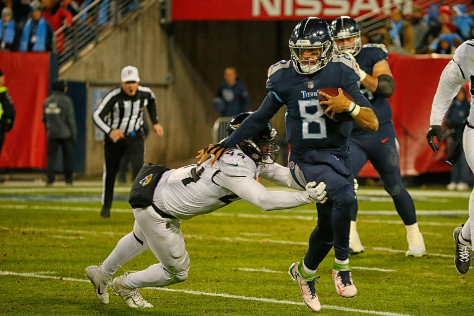 Titans quarterback Marcus Mariota wore five different cleats on Thursday that were designed by students from a Washington high school. (Photo by Frederick Breedon/Getty Images)