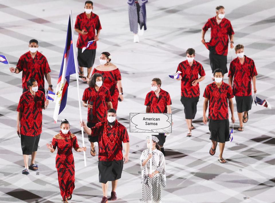 The athletes wore multi-colored printed tops with dark skirts