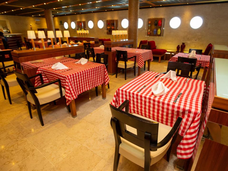 Tables with red and white checkered tablecloth.