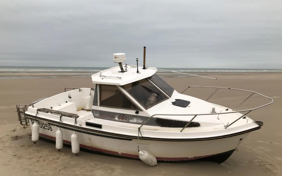 This boat, which ran aground and was abandoned last week, was seen today carrying ten migrants across the Channel, before getting into difficulties - Jamie Johnson