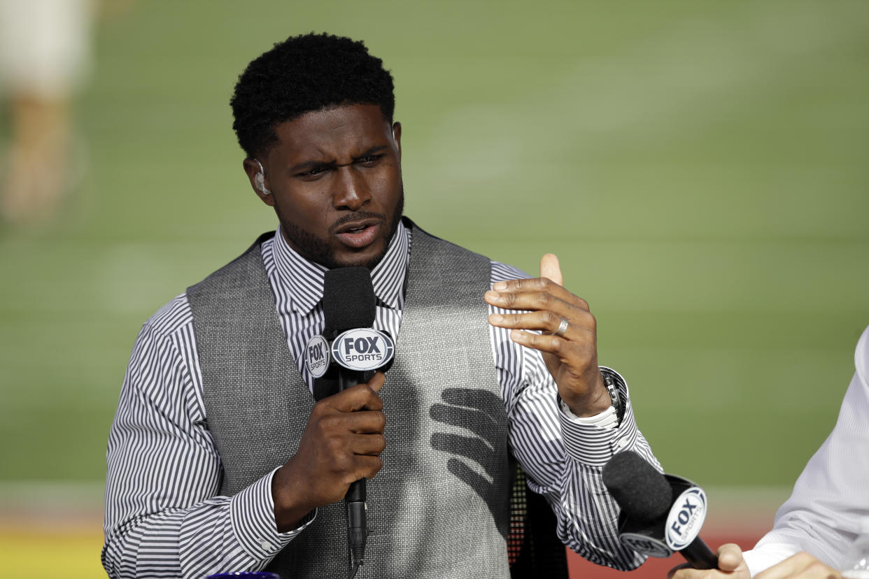 Former Southern California player Reggie Bush rehearses for a pregame show, at an NCAA college football game between Southern California and Utah on Friday, Sept. 20, 2019, in Los Angeles. (AP Photo/Marcio Jose Sanchez)