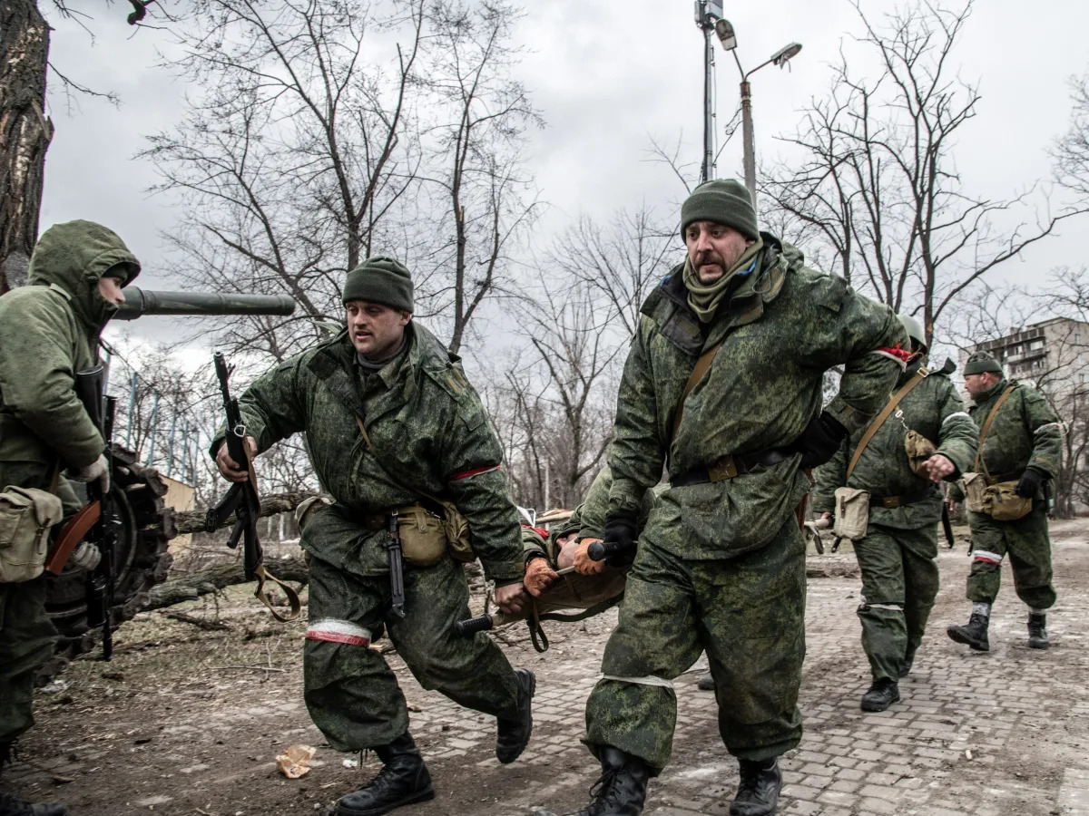 A soldier with neo-Nazi symbols on his arm was given a medal by a Russia-backed ..