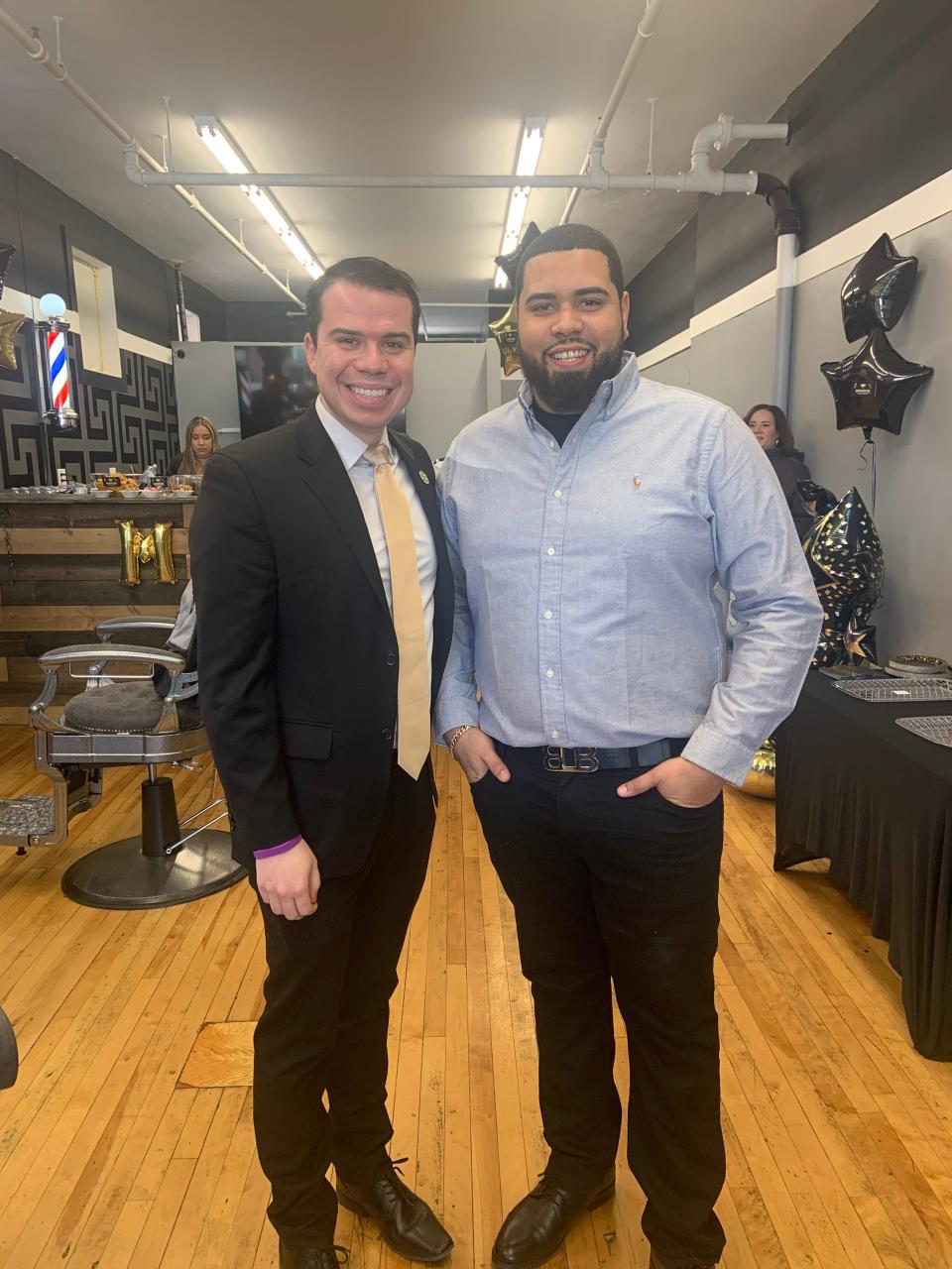 Mayor Michael Nicholson, left, and owner Vincent Santana at the grand opening ceremony for the MVP Barber Studio II in Gardner on Monday, Feb. 5.