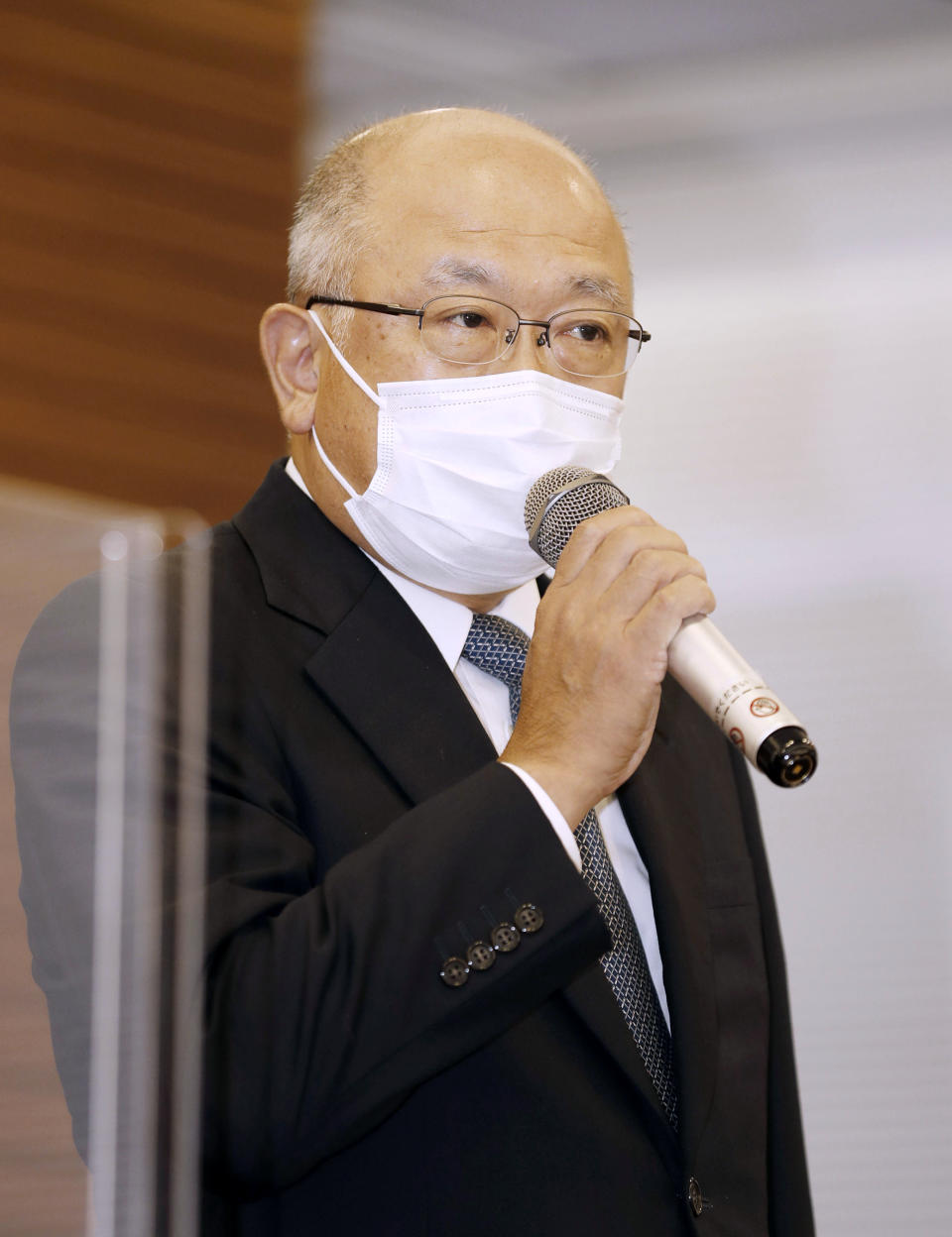 Mitsui O.S.K.Lines Representative Director Akihiko Ono speaks during a press conference in Tokyo, Sunday, Aug. 9, 2020. The owners and operators of the grounded ship Wakashio on Sunday apologized for the accident that has led to tons of fuel leaking into Mauritius waters. (Kyodo News via AP)