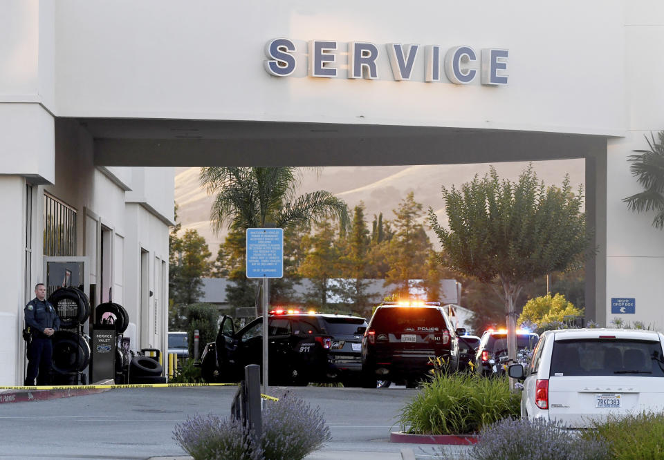 Police investigate at the scene of a shooting at the Morgan Hill Ford Store in Morgan Hill, Calif., Tuesday, June 25, 2019. Police say at least three people were shot including the suspect in what may be a workplace confrontation. (AP Photo/Nic Coury)