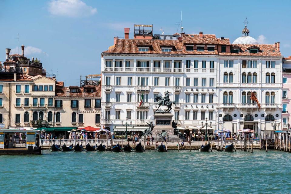 Promenade Riva Degli Schiavoni, hotel and Monument to Victor Emmanuel II in Venice, Italy