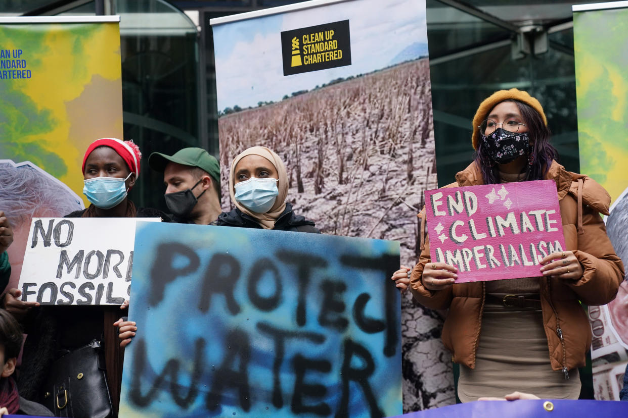 Young activists take part in the Youth Strike to Defund Climate Chaos protest against the funding of fossil fuels outside Standard Chartered Bank in London. Picture date: Friday October 29, 2021.