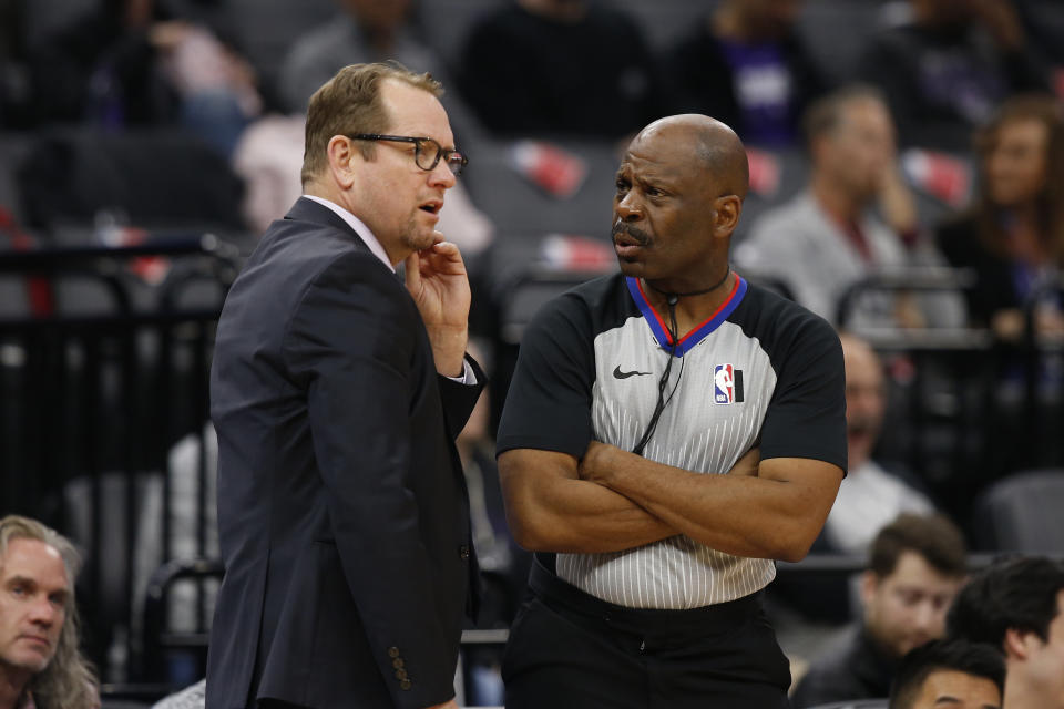 Toronto Raptors head coach Nick Nurse, left, talks with referee Derek Richardson during the second half of an NBA basketball game against the Sacramento Kings in Sacramento, Calif., Sunday, March 8, 2020. The Raptors won 118-113. (AP Photo/Rich Pedroncelli)