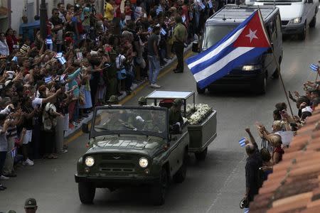 People view the caravan carrying Cuba's late President Fidel Castro's ashes in Ciego de Avila, Cuba, December 1, 2016. REUTERS/Enrique De La Osa