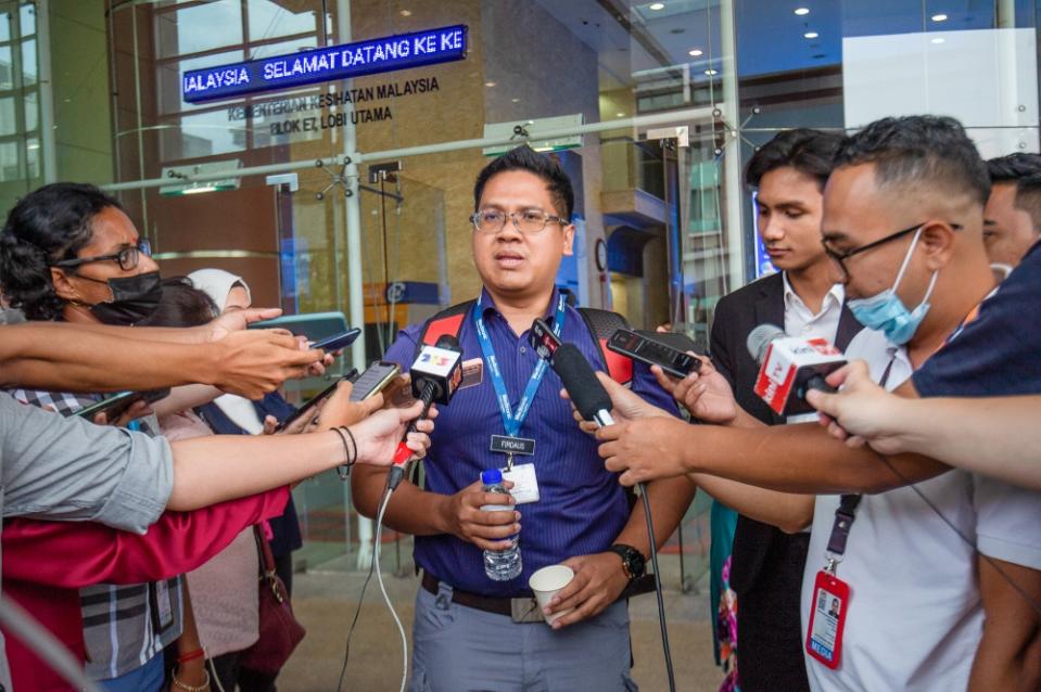 Permanent doctor at Hospital Melaka Dr Firdaus Omar speaks to the media after a townhall session between the Health Ministry and contract doctors in Putrajaya February 22, 2023. — Picture by Shafwan Zaidon
