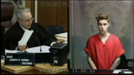 Pop singer Justin Bieber appears in front of Judge Joseph Farina by video link in this still image from video from Miami, Florida January 23, 2014. REUTERS/Pool