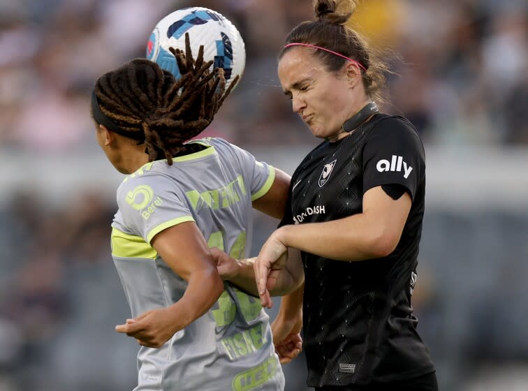 LOS ANGELES, CALIFORNIA - AUGUST 10: Megan Reid #6 of Angel City FC and Mia Fishel #10 of Tigres Femenil head a cross during the first half of an international friendly at Banc of California Stadium on August 10, 2022 in Los Angeles, California. (Photo by Harry How/Getty Images)