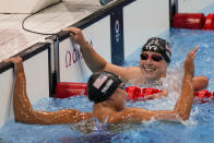 Katie Ledecky, right, of the United States, celebrates after winning the women's 1500-meters freestyle final with Erica Sullivan, of the United States, at the 2020 Summer Olympics, Wednesday, July 28, 2021, in Tokyo, Japan. (AP Photo/Charlie Riedel)