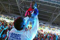 <p>Yannick Borel of France celebrates with his child after winning the men’s épée team match against Italy.</p>