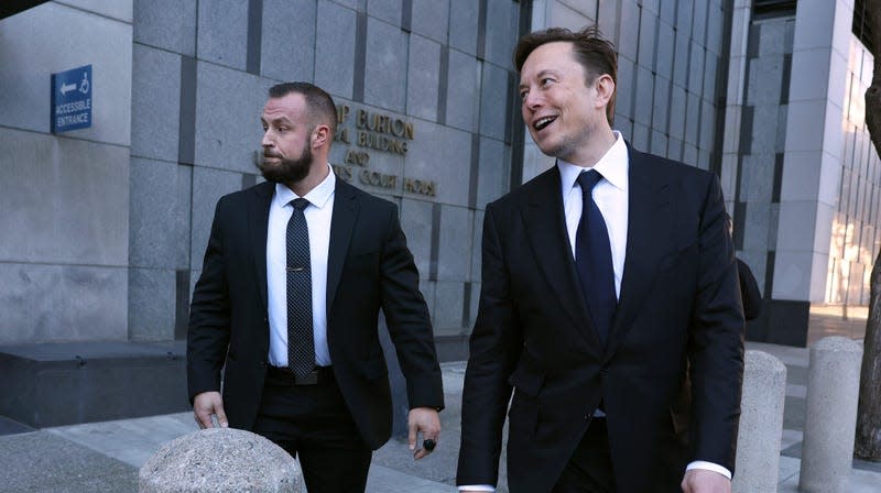 Twitter and Tesla CEO Elon Musk (R) leaves the Phillip Burton Federal Building on January 24, 2023 in San Francisco, California. Musk testified at a trial regarding a lawsuit that has investors suing Tesla and Musk over his August 2018 tweets saying he was taking Tesla private with funding that he had secured.