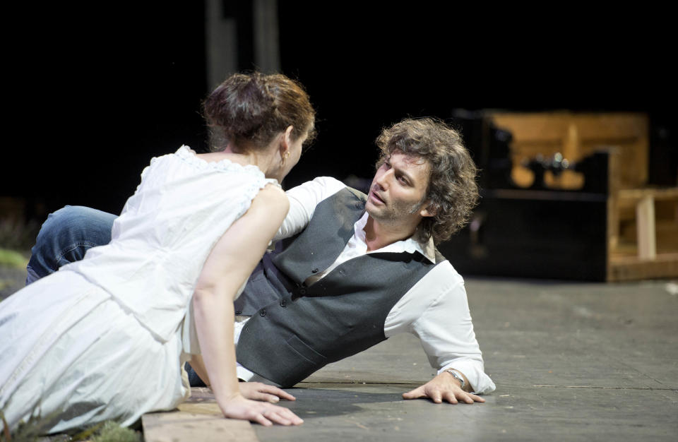 In this undated photo provided by Alla Scala theater press office, Jonas Kaufmann, right, who plays Lohengrin, and Anja Harteros, playing Elsa, perform during rehersals of Richard Wagner's Lohengrin at the Milan La Scala opera house, Italy. The dual bicentennial of the births of composers Giuseppe Verdi and Richard Wagner is turning into a dueling bicentennial. La Scala general manager Stephane Lissner on Monday, Dec. 3, 2012 dismissed as "ridiculous" criticism by the Italian media because the famed Milan opera house that was once Verdi's musical home is opening the celebratory season with Wagner's "Lohengrin." No less than Italy's respected President Giorgio Napolitano entered the fray. He wrote a letter to musical director Daniel Barenboim rejecting press rumors that he was snubbing the gala season opener on Friday. (AP Photo/Monika Rittershaus, La Scala)