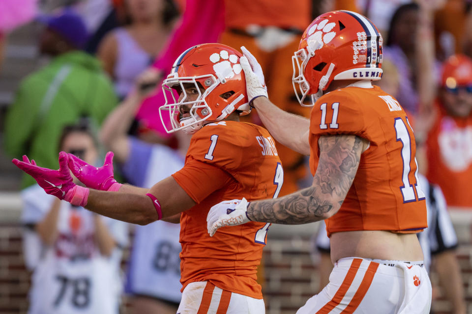 Clemson running back Will Shipley (1) celebrates after scoring a touchdown with tight end Sage Ennis (11) during the second half of an NCAA college football game against Wake Forest Saturday, Oct. 7, 2023, in Clemson, S.C. (AP Photo/Jacob Kupferman)