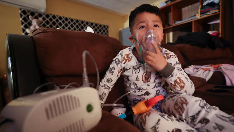 Ruben Mandujano, who has asthma and is autistic, uses a nebulizer with albuterol at his home near the Salton Sea and Mecca, California, on Thursday, Dec. 14, 2023. Ruben, 5, doesn’t like the nebulizer, as it often makes him throw up, but knows it is necessary when he is sick.