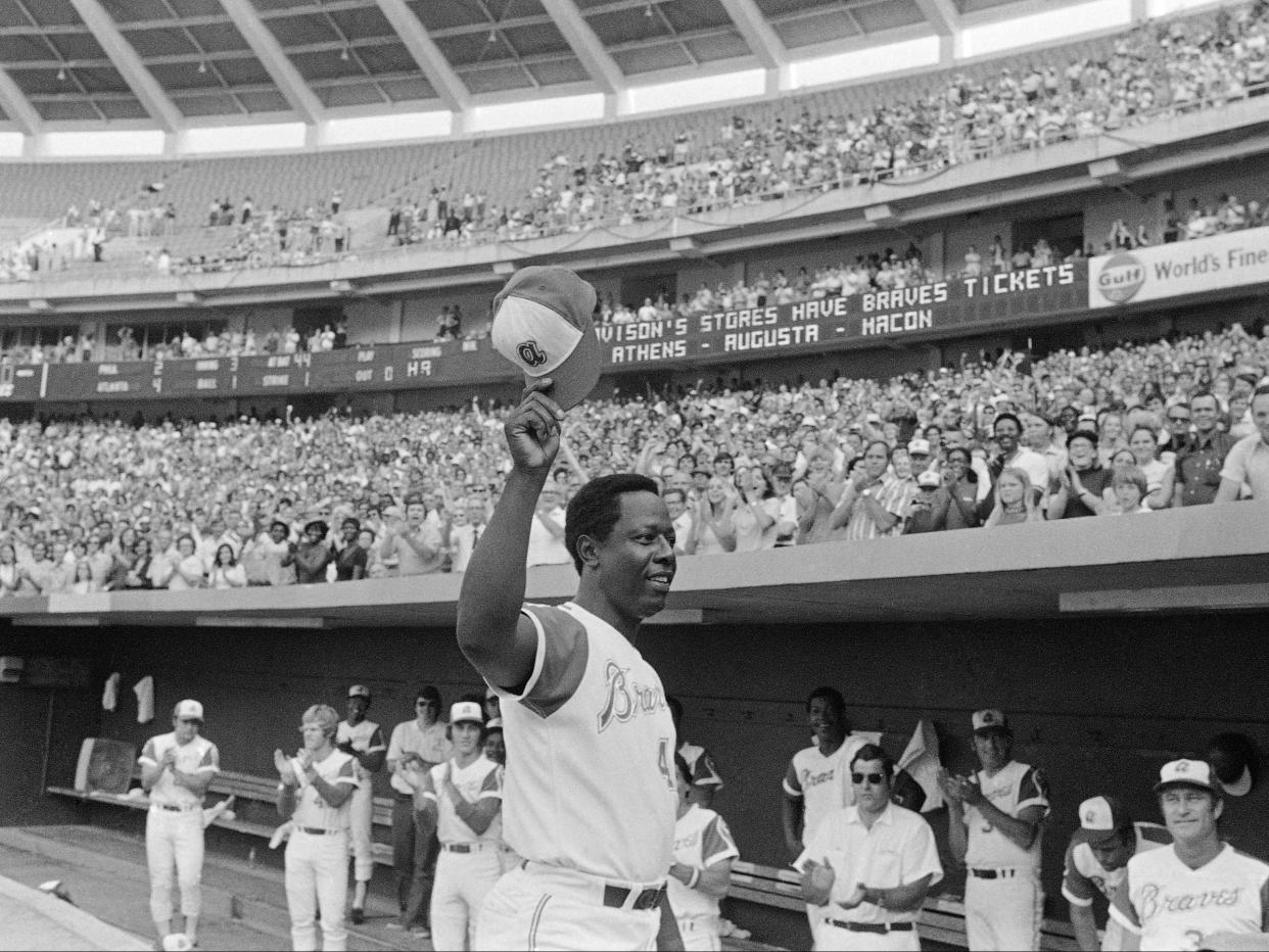 <p>Hank Aaron of the Atlanta Braves reacts Saturday, on 21 July 21 1973, in Atlanta after hitting 700th career home run against the Philadelphia Phillies</p> ((Associated Press))