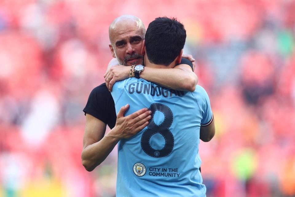 Guardiola embraces Gundogan at full time (REUTERS)