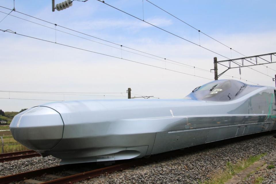 Japan is about to start testing its fastest ever bullet train, which can reach speeds of up to 400kph.The Alfa-X train will be put into service in 2030, with plans to run it at 360kph. This will make it faster than China’s Fuxing Hao service linking Beijing and Shanghai in four hours and 18 minutes.Alfa-X’s first test journey will take place on Friday 17 May, running overnight between Aomori and Sendai. It’s the first of several trial runs that will be conducted over the next three years.The plan is to use the super-fast shinkansen to create a high-speed connection to Sapporo, the biggest city on the northernmost island of Hokkaido, from the main island of Honshu.“The development of the next-generation shinkansen is based on the key concepts of superior performance, a high level of comfort, a superior operating environment and innovative maintenance,” East Japan Railway Co said in a statement.The 10-car train has a 22m-long nose at the front to reduce air resistance when entering tunnels. It will also have air brakes on the roof, plus magnetic plates on the bottom, as well as conventional brakes, to aid with slowing down.Air suspension and dampers will help create a stable ride for passengers, especially when the train is taking on corners at speed. It follows China’s announcement in January that it plans to introduce the world’s first driverless trains to run at speeds of up to 350kph on the Beijing-Zhangjiakou railway line.The automatic operation bullet trains were trialled on a section of the Beijing-Shenyang line in 2018 by the China Railway Corporation (CRC) and the system passed all safety tests.“The bullet train can automatically depart, operate between stations and adjust the train’s operation to meet its precise timetable after a single button is pressed,” a researcher from China Academy of Railway Sciences told the Sciences and Technology Daily. For the first 10 years of the high-speed ATO trains, an attendant will still be deployed on board to ensure nothing goes wrong. After that, the trains will be totally driverless.