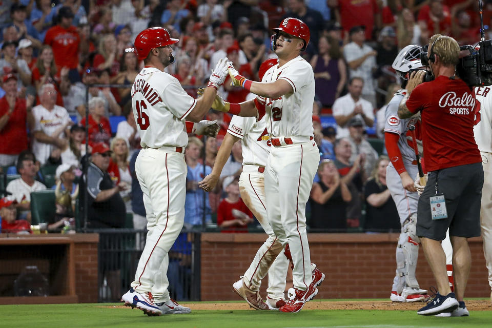 St. Louis Cardinals' Lars Nootbaar, front right, is congratulated by Paul Goldschmidt for a three-run home run against the Cincinnati Reds during the second inning of a baseball game Saturday, Sept. 30, 2023, in St. Louis. (AP Photo/Scott Kane)